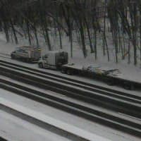 <p>I-95 is covered with snow, and a disabled truck is on the shoulder, at Riverside Lane in Greenwich on Thursday afternoon. </p>