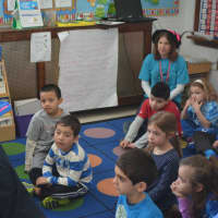 <p>Bedford school board member Jennifer Gerken reads to kids at Bedford Hills Elementary School. She aloud from the Dr. Seuss book &quot;What was I Scared of?&quot;</p>