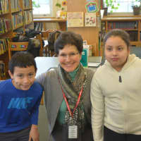 <p>Bedford school board President Susan Wollin poses for a photo with kids at Bedford Hills Elementary School.</p>