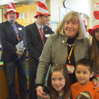 <p>Bedford Town Clerk Boo Fumagalli poses for a photo with kids at Bedford Hills Elementary School. Fumagalli was one of several town officials who visited for the school&#x27;s Dr. Seuss reading.</p>