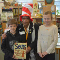 <p>Velma Lewis, a deacon and Antioch Baptist Church, poses for a photo with kids at Bedford Hills Elementary School.</p>