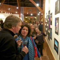 <p>Visitors discuss photos at the Tree Conservancy of Darien&#x27;s photo contest over the weekend.</p>