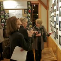 <p>Visitors view the entries at the Tree Conservancy&#x27;s photo contest.</p>