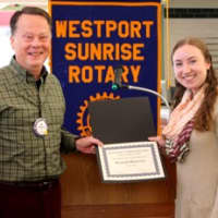 <p>Joe Hawley, the Sunrise Rotarys Student of the Month Chair, presents Hannah Malowitz with a certificate of recognition and a $50 gift card card from Barnes &amp; Noble. </p>