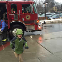 <p>Jeremy and Miles were thrilled to get to ride in the firetruck with the lights and sirens going off before arriving at their party.</p>