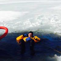 <p>Yonkers firefighters participate in ice rescue training at Tibbetts Brook Park.</p>