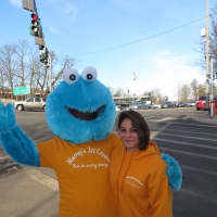 <p>Cookie Monster, left, and Dana of Murray&#x27;s Ice Cream welcomed springlike temperatures on Wednesday at the corner of Halstead and Harrison avenues in Harrison.</p>