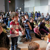 <p>Kids watch the museum band perform.</p>
