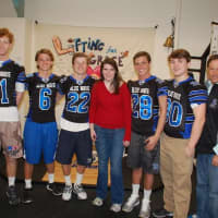 <p>From left, Darien football captains Tim Graham, Colin Minicus, Hudson Hamill, Grace Wohlberg, Bobby Trifone, Mark Evanchick and Darien football oach Rob Trifone get ready for &quot;Lifting Grace.&quot; Missing is: Christian Trifone.</p>