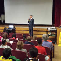 <p>White Plains Mayor Tom Roach confesses to schoolchildren that he likes pizza, but eats Brussels sprouts, too.</p>