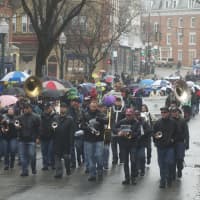 <p>Marchers try to stay dry.</p>