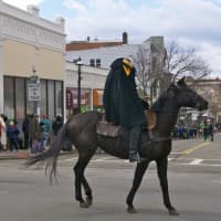 <p>The Headless Horseman makes his way down Main St. in Sunday&#x27;s parade.</p>