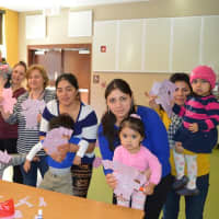 <p>The kids show off their artwork at the  Play to Learn Playgroups at Park Avenue School in Danbury. </p>