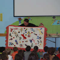 <p>An author visits the school and does a read-aloud with students. </p>