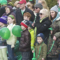 <p>Spectators watch the parade Sunday in Tarrytown.</p>