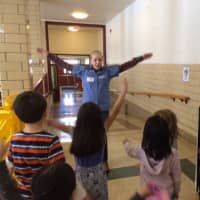 <p>Kathryn Marcon helps students get moving.</p>