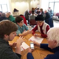 <p>Somers teens volunteer to help seniors learn more about their electronic devices. </p>