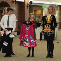 <p>Denis Jr., Kaitlyn and mom Heidi show and assortment of dresses traditionally worn in Irish Dance Competitions.</p>