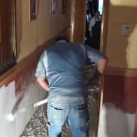<p>Crews continue to put finishing touches on hallways and &quot;the fireplace room&quot; at the flood-damaged restaurant.</p>