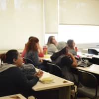 <p>Students listen to a workshop on How to Build an LGBTQA Center (with Kelly Herbert presenting)</p>
