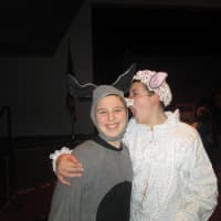 <p>Jack Tinari as Donkey and Tyler Rodriguez as the Big Bad Wolf share a moment.</p>