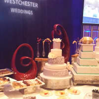 <p>Staff from the Hilton Westchester handed out slices of wedding cake as well as pastries to hundreds of Business Expo visitors.</p>