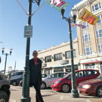 <p>Jon Campbell with a few of his banners in Stamford.</p>