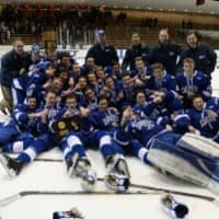 <p>Darien High School hockey players celebrate after defeating Greenwich for the Division I state title.</p>