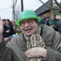 <p>A spectator waves hello at the 2015 Yonkers St. Patrick&#x27;s Day Parade.</p>