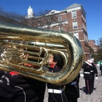 <p>A member of the Port Chester Marching Band can be seen through a trombone at the Greenwich St. Patrick&#x27;s Day parade Sunday.</p>