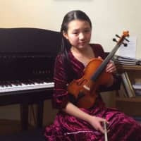 <p>Joanna Wang of Scarsdale plays the violin.</p>