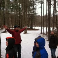 <p>Steve Conaway, conservation and outreach director, shows how a tree&#x27;s branches spread out for the sun.</p>