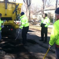 <p>City workers, from left Aaron Turner and Joseph Coplon shovel out hot asphalt to fill a pothole while Thomas Turk, Traffic &amp; Road Maintenance Supervisor, and Rob Loffredo, at right, watch. </p>