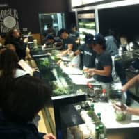 <p>Happy and patient customers at the opening of Chop&#x27;t Wednesday in Riverside. </p>