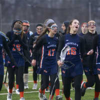 <p>The Quakers enjoy a moment of celebration after winning their season opener at Carmel.</p>