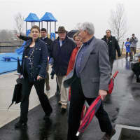 <p>Officials and residents walk the grounds at the new Cos Cob Park.</p>