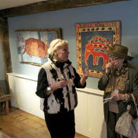 <p>June Myles discusses her work with visitors at the Wilton Historical Society.</p>
