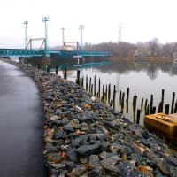 <p>The waterfront path leads to the train bridge. </p>