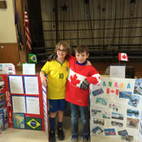 <p>From left, Royle Elementary School students Finnigan Kern (Brazil) and Peter Gregory (Canada) represent various countries during Royle&#x27;s annual Country Festival.</p>