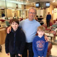 <p>George Schiavone, owner of George&#x27;s Hair Salon in the Quaker Ridge Shopping Center, with Noam Bramson&#x27;s sons before. </p>