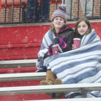 <p>Fans try to stay warm at Fox Lane High School.</p>