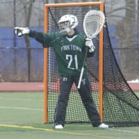 <p>Yorktown keeper Liam Donnelly directs traffic.</p>
