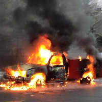 <p>The truck is fully engulfed in flames on East Putnam Avenue in Greenwich on Monday morning.</p>