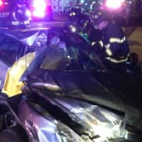 <p>The driver was trapped in this severely damaged car after a crash early Monday on Black Rock Turnpike near Burroughs Road in Fairfield. </p>