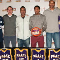 <p>Stamford Peace co-founder and Director of Basketball Operations, Lenwood Latta, left, and coach Brian Kriftcher, right, salutte players Ryan Kriftcher, Tyrell St. John, Jeremiah Livingston and Kweshon Askew.</p>