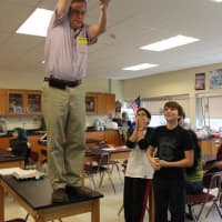 <p>Matt Thoennes, an IBM senior engineer, climbed atop a desk in a science lab with seventh-graders and dropped the egg contraptions onto plastic sheeting taped to the floor.</p>