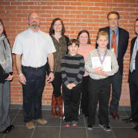 <p>Walden teaching assistant Janet Patslsno, special ed teacher Tom Oaks, speech and language therapist Carly Dreher, Ethan OMealia, Ruth OMealia, Evtin OMealia, Walden principal Michael Sowul and BOCES director of special ed Adam Van Der Stuyf. </p>