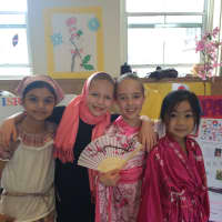 <p>From left, Royle Elementary School students Rithwika Veeturi (Jamaica), Sophia Wood (Israel), Zoe Jones (Japan), and Joyce Huang (Japan) represent various countries during Royle&#x27;s annual Country Festival.</p>