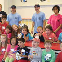 <p>Campers and staff show off their arts and crafts project during 2014 mini camp</p>