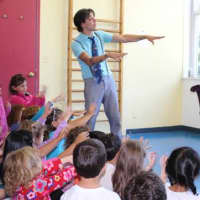 <p>Pre-school campers get ready for Mario the Magician to start the magic.

 </p>